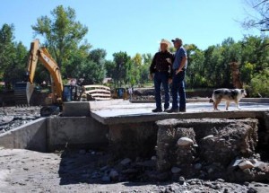 David M Jessup surveying flood damage at Sylvan Dale Ranch